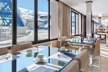 a room with a table and chairs