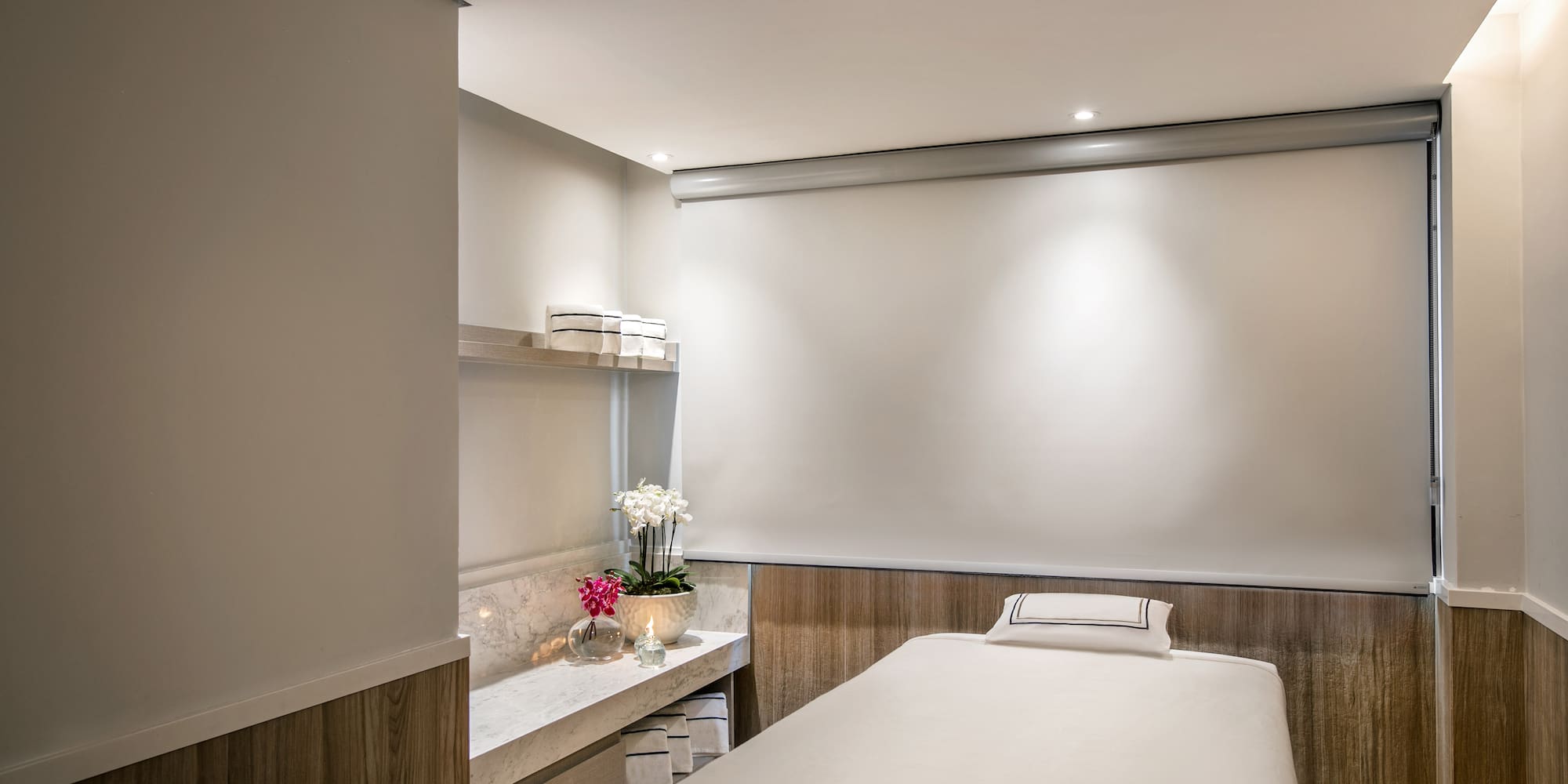 a massage room with a white board