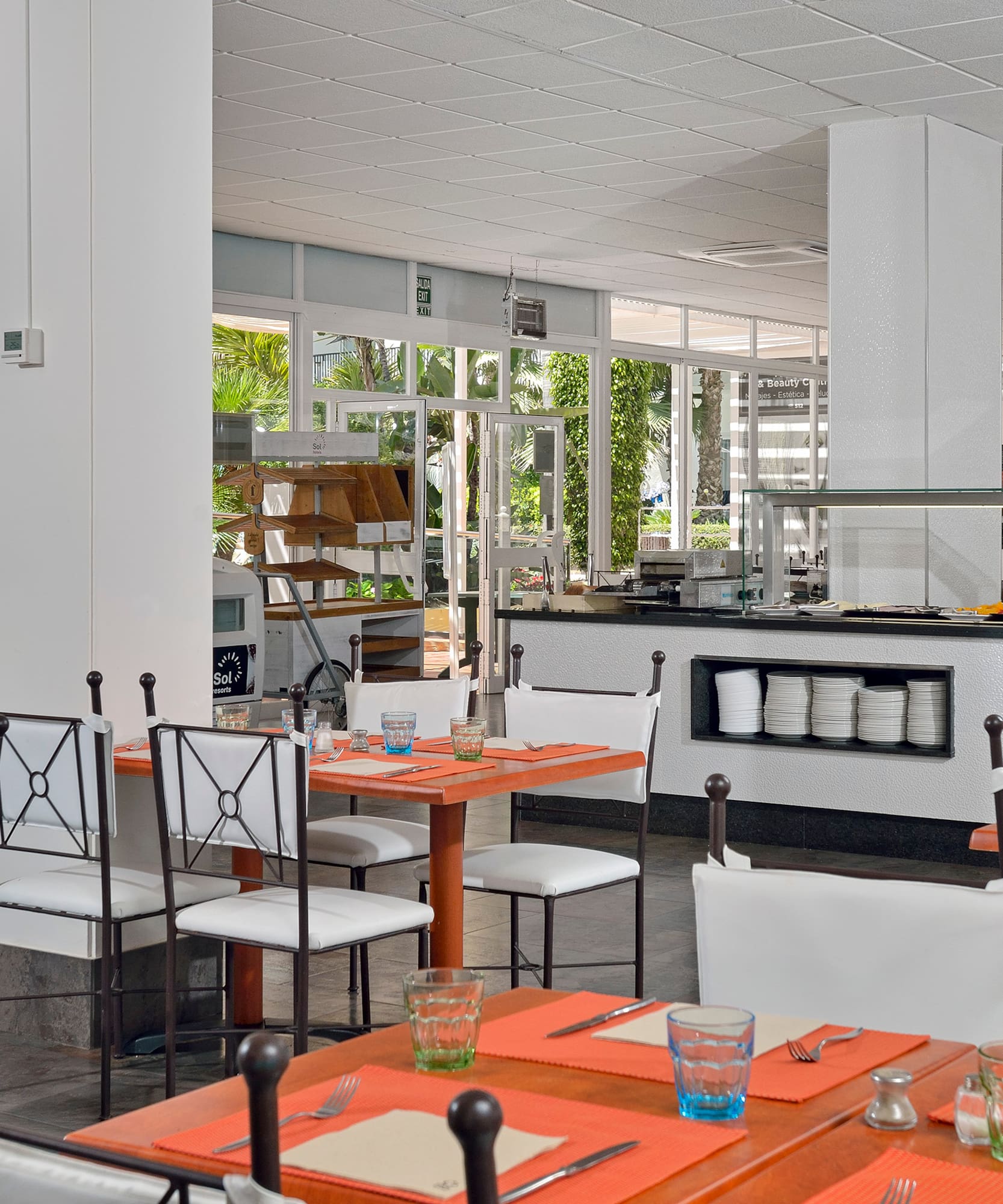 a restaurant with tables and chairs