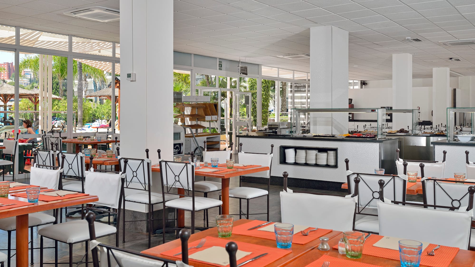 a restaurant with tables and chairs