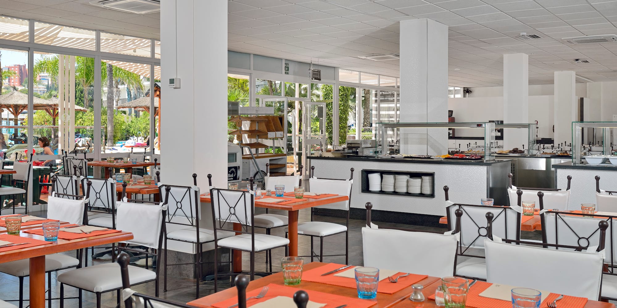 a restaurant with tables and chairs