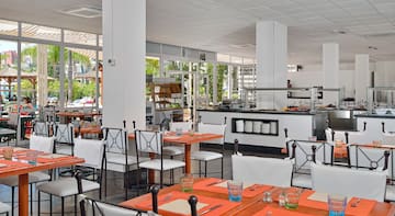 a restaurant with tables and chairs