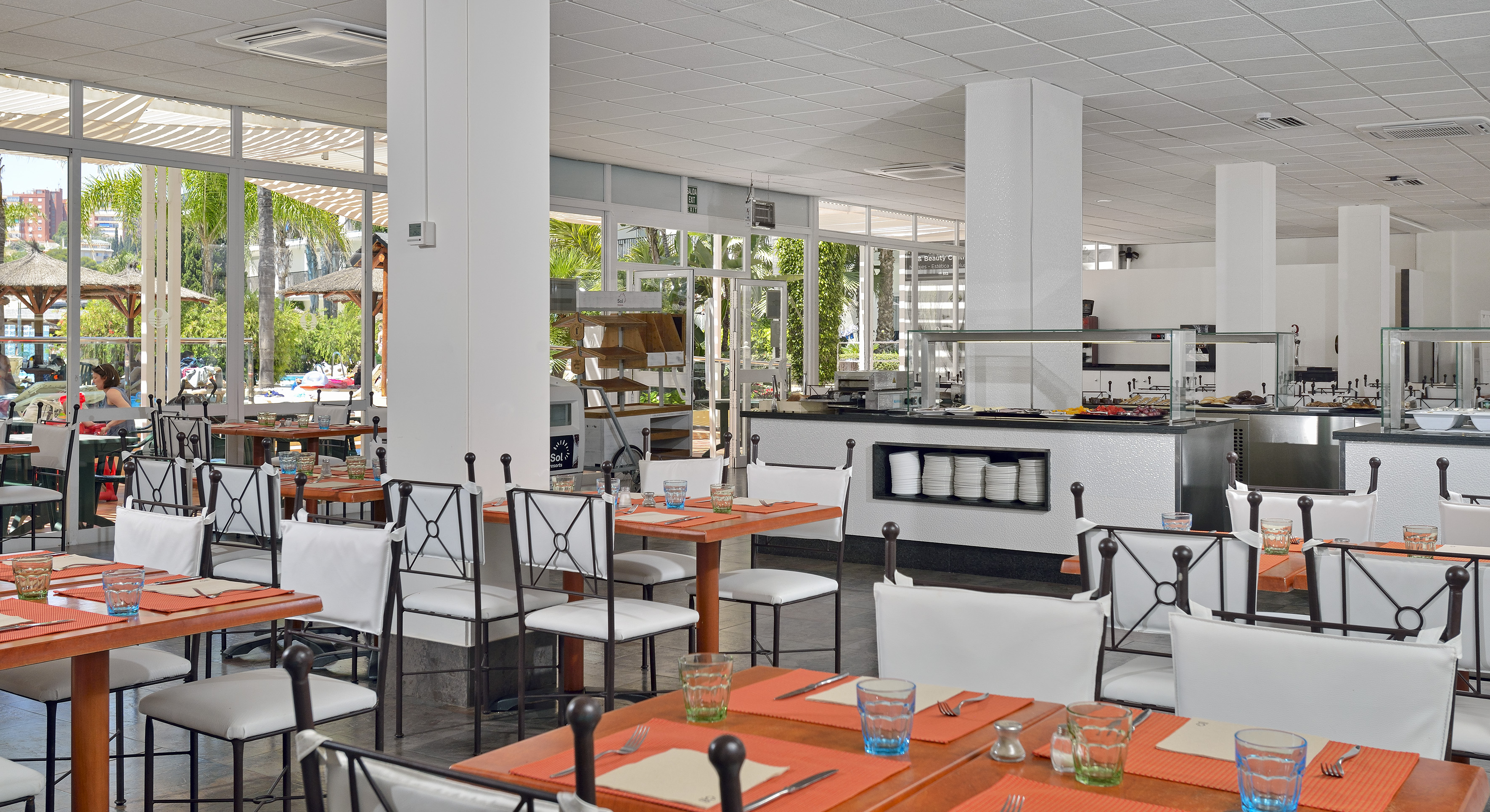 a restaurant with tables and chairs