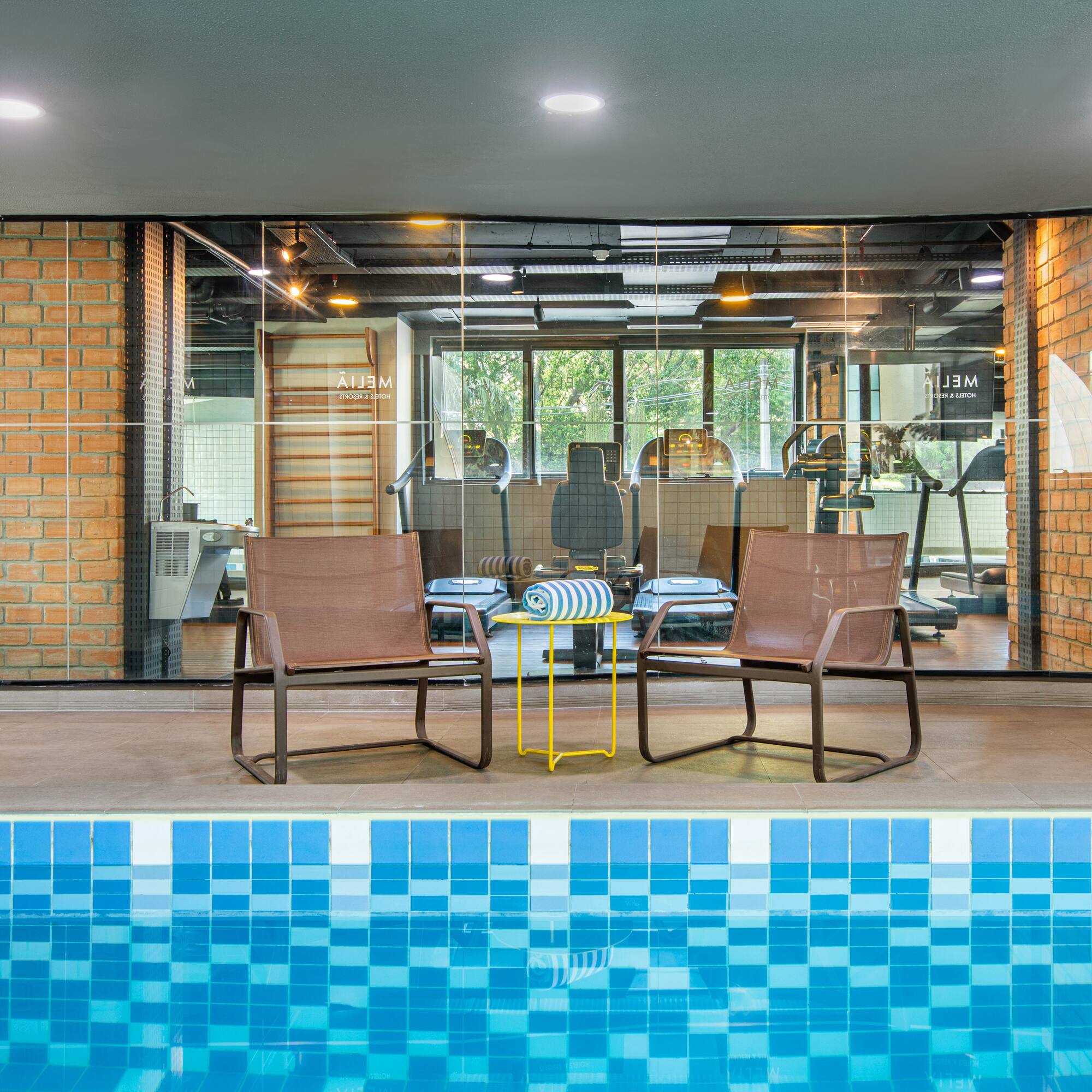 a pool with chairs and a table