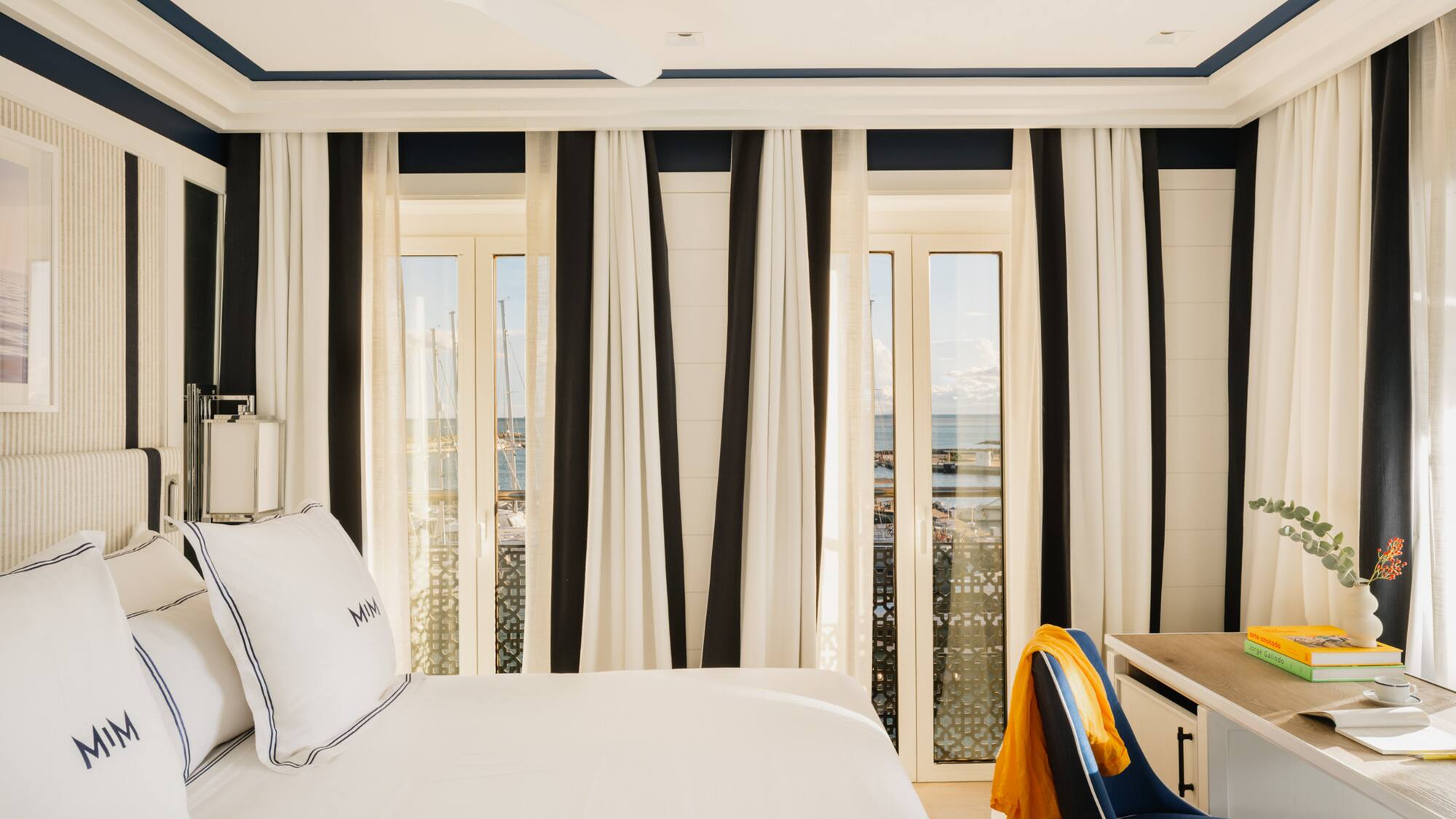 a room with a bed and a desk