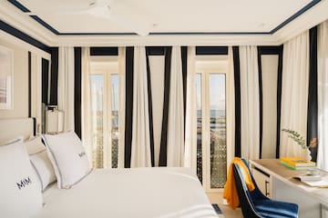 a room with a bed and a desk