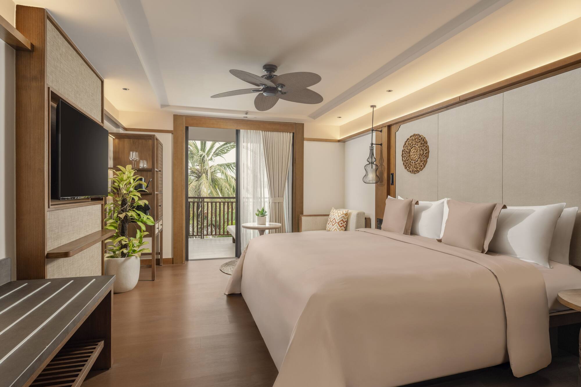 a bedroom with a television and a bed