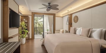 a bedroom with a television and a bed