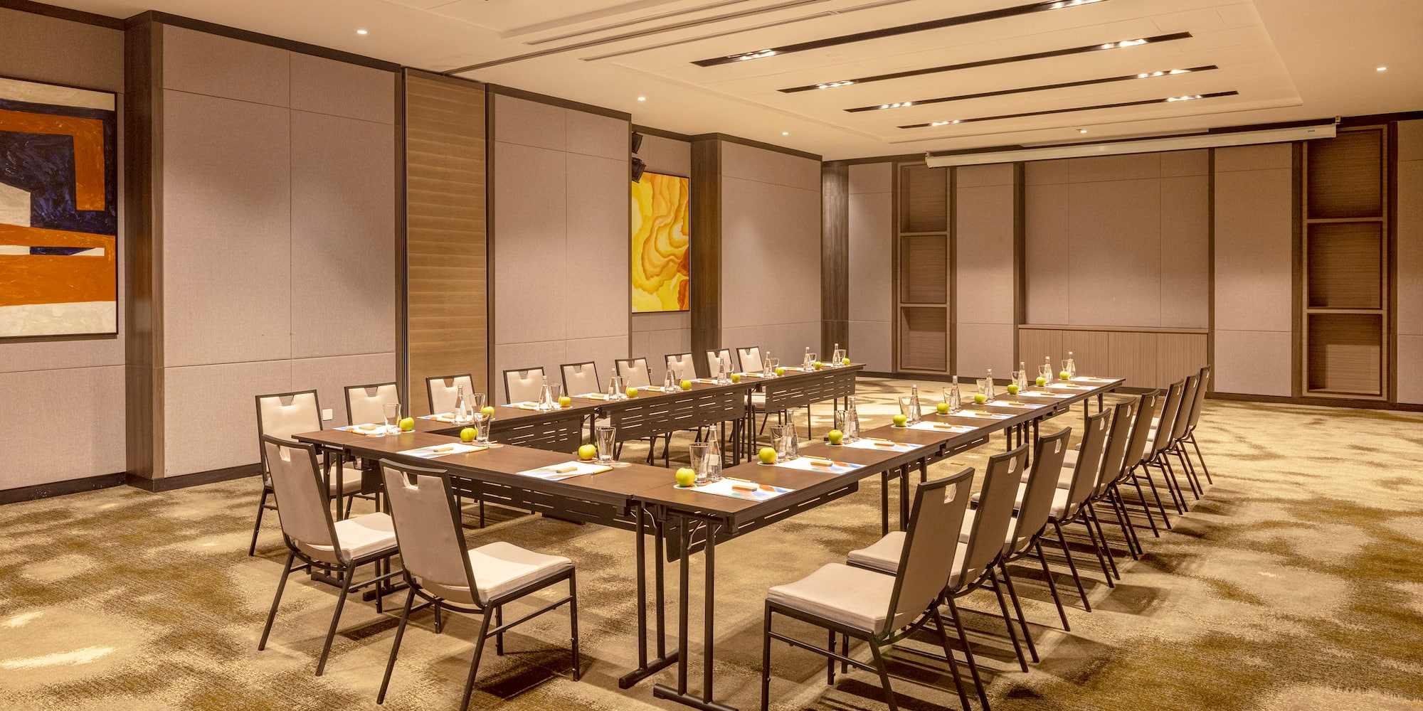 a room with a long table and chairs