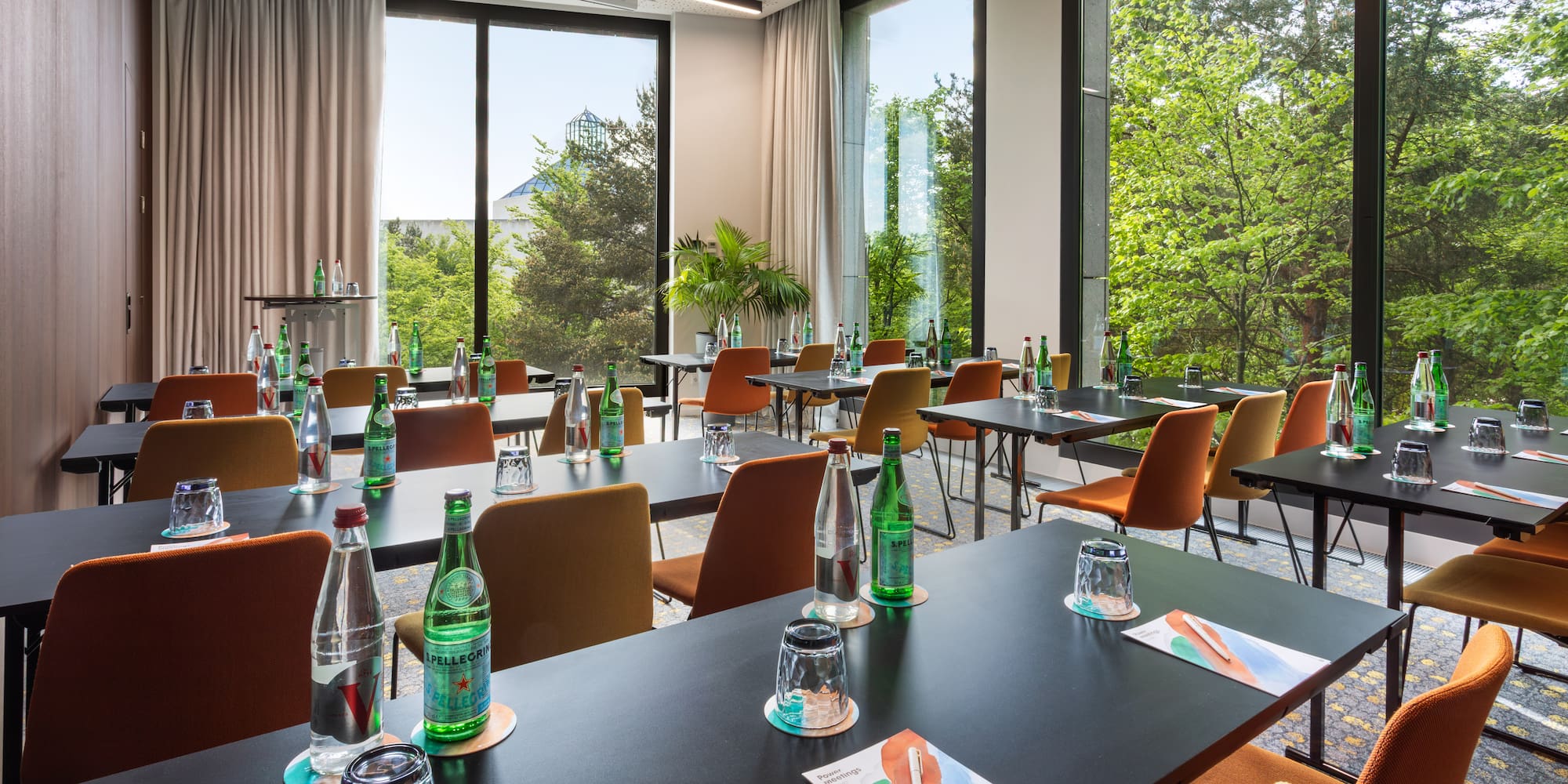 a room with tables and chairs and a window