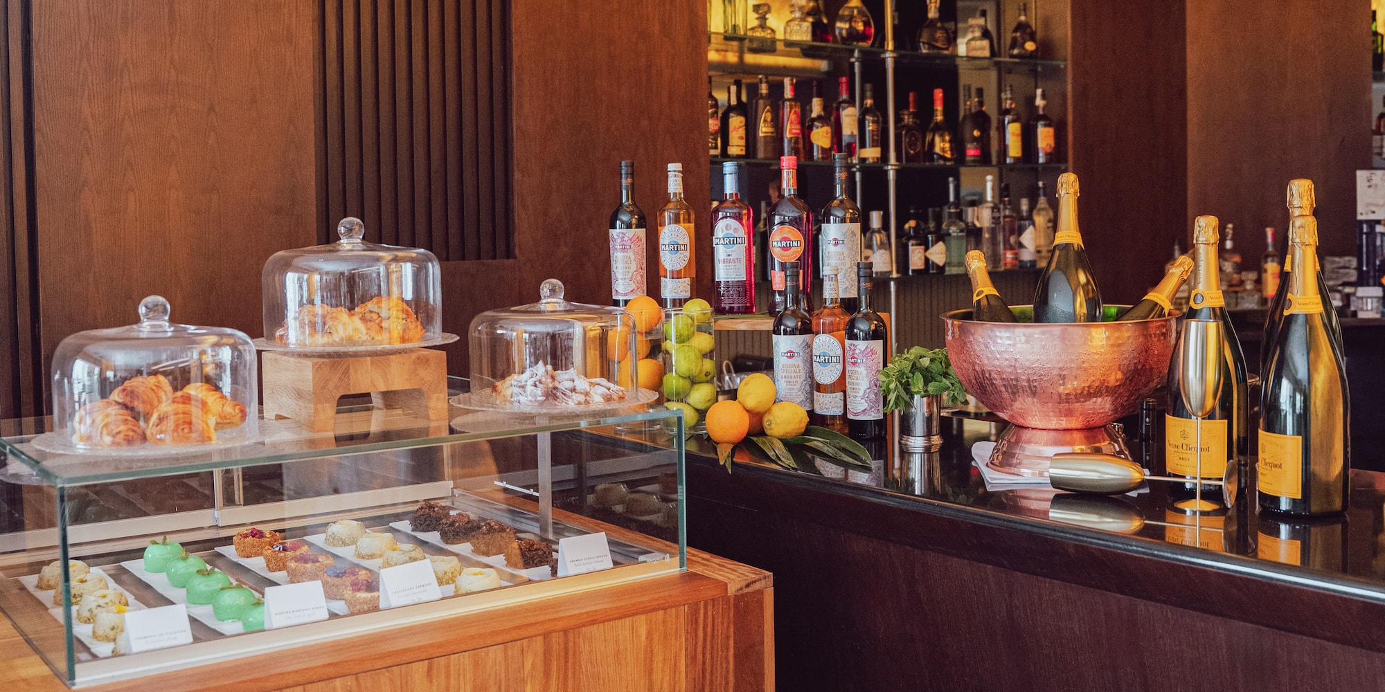 a bar with bottles of liquor and fruit on it