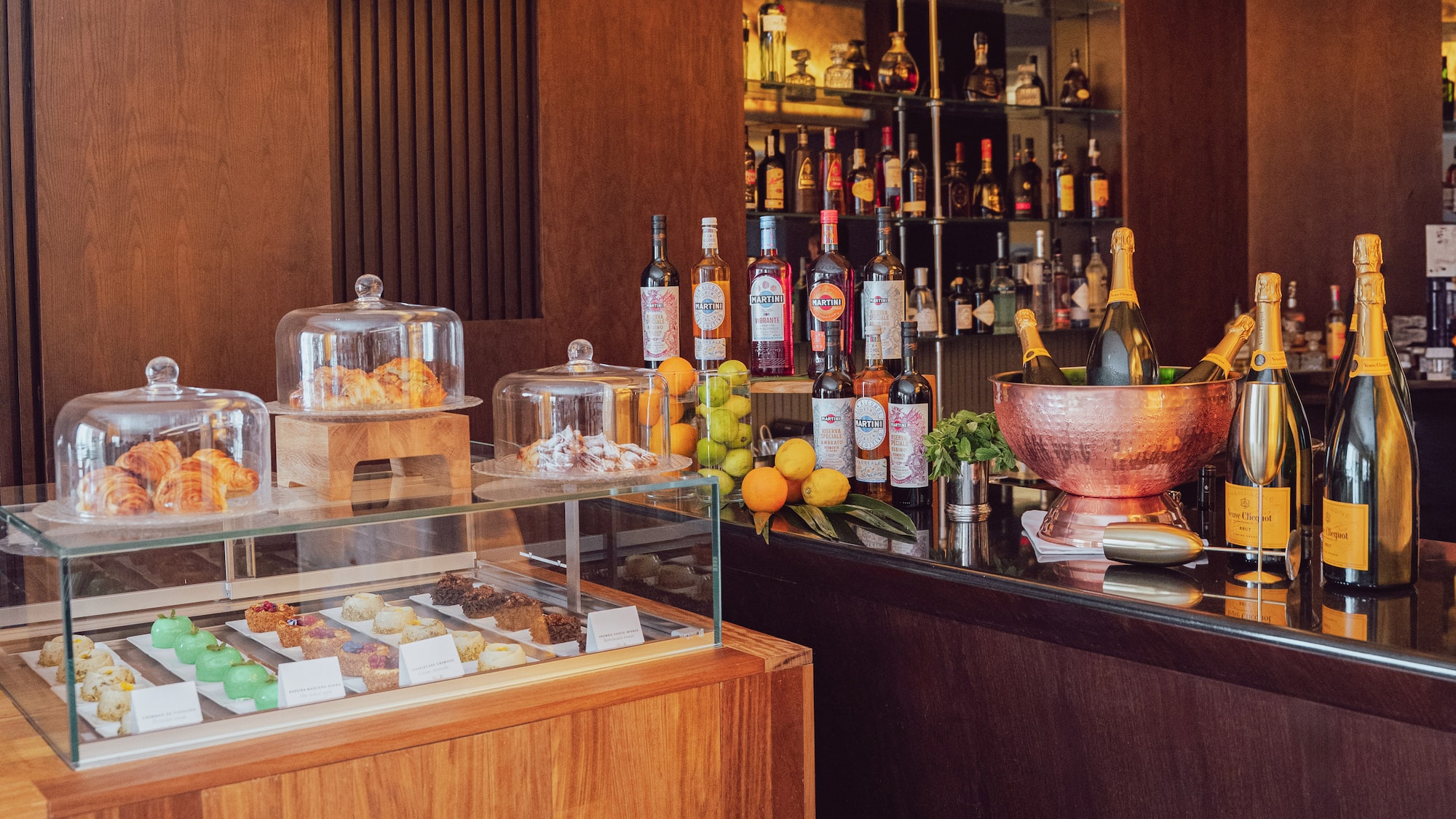a bar with bottles of liquor and fruit on it