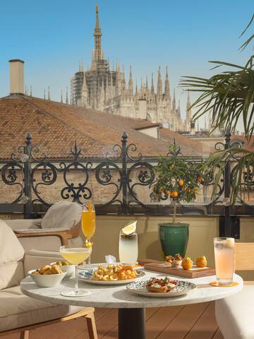 a table with food on it and a plant on it