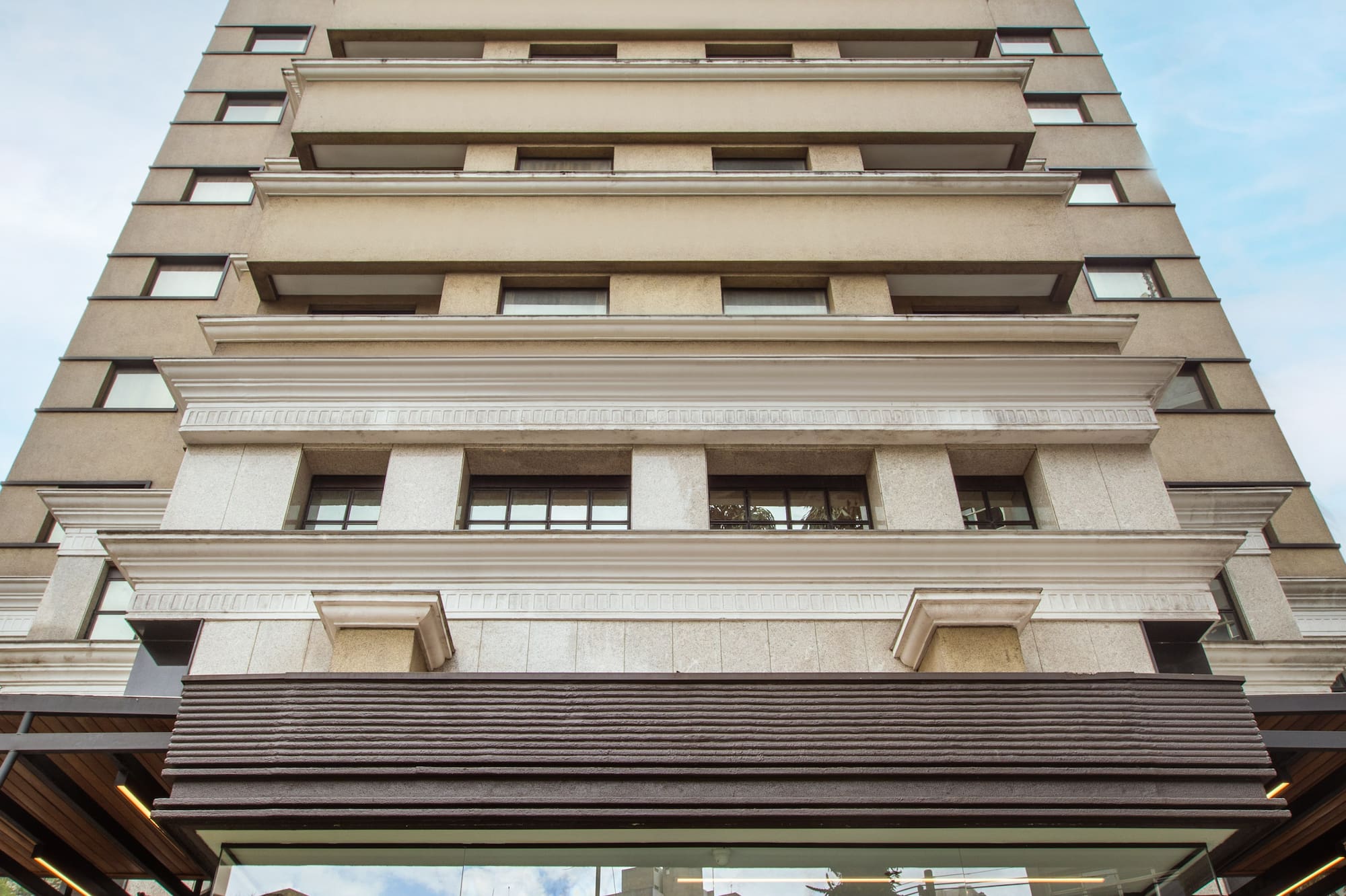 Tall modern INNSIDE hotel building, glass entrance with prominent logo.