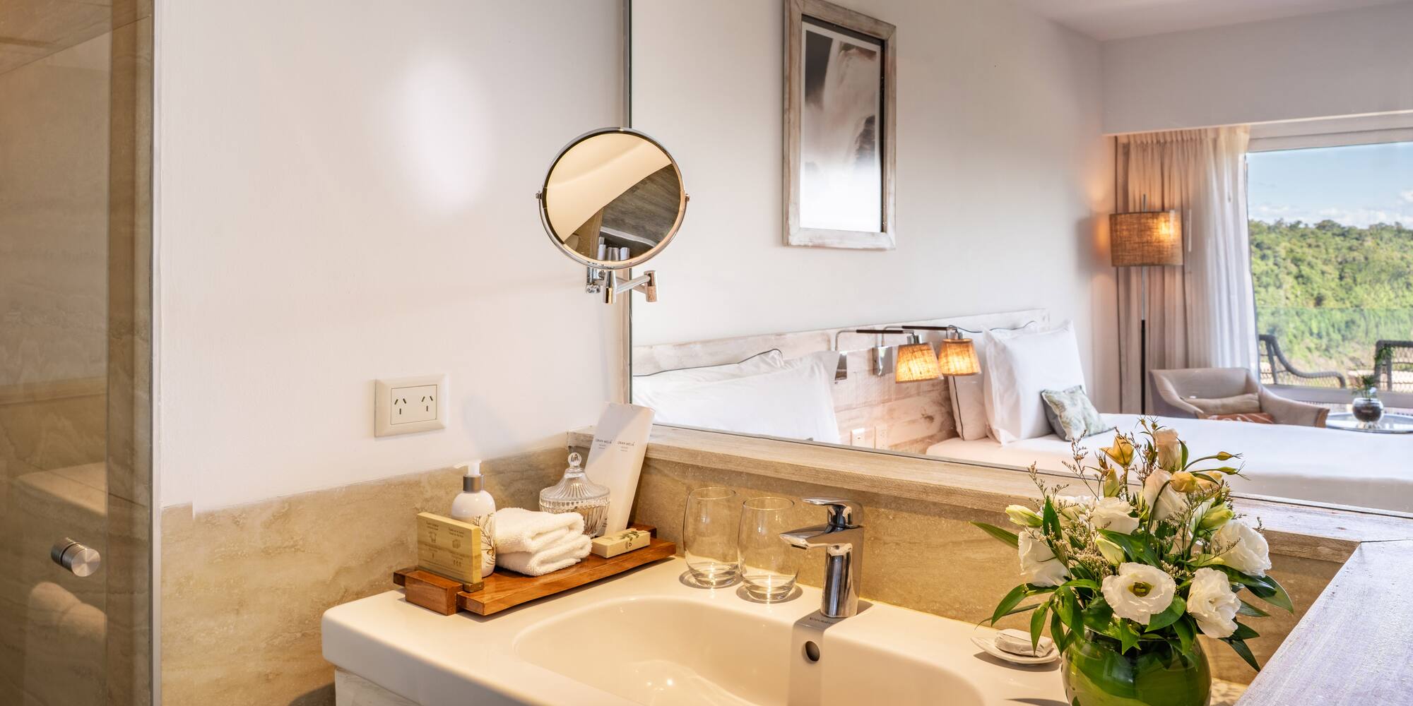 a bathroom with a mirror and a sink