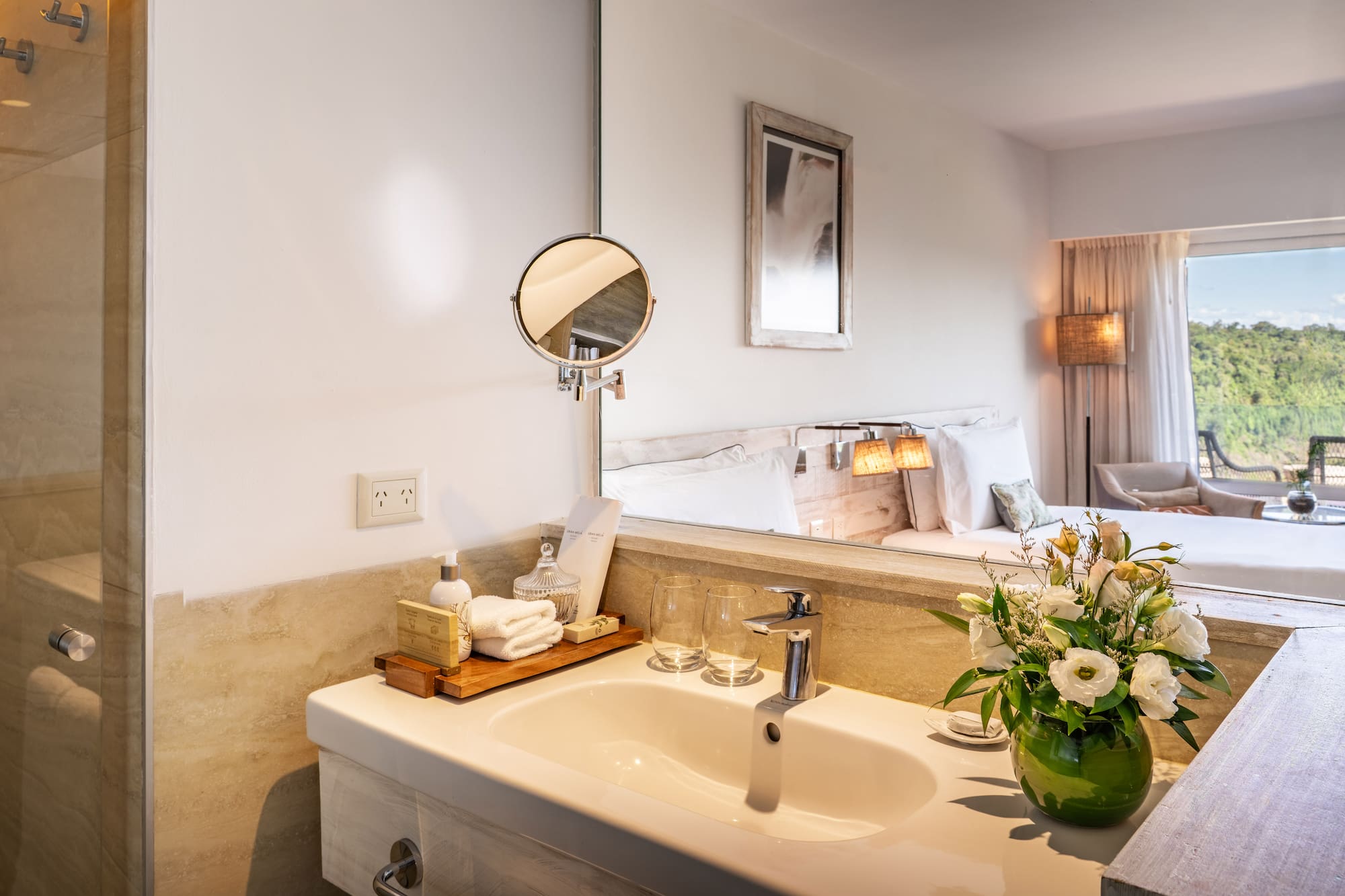 a bathroom with a mirror and a sink