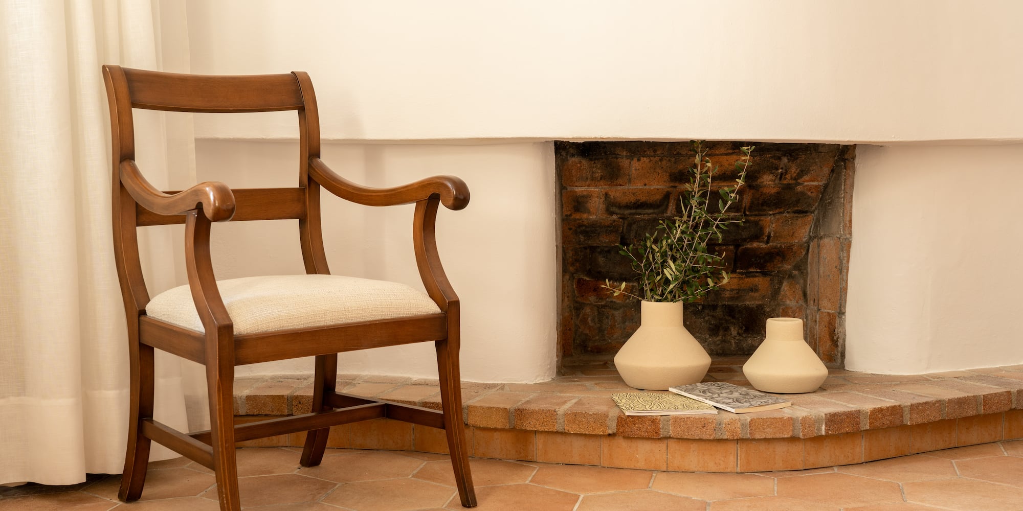 a chair next to a fireplace