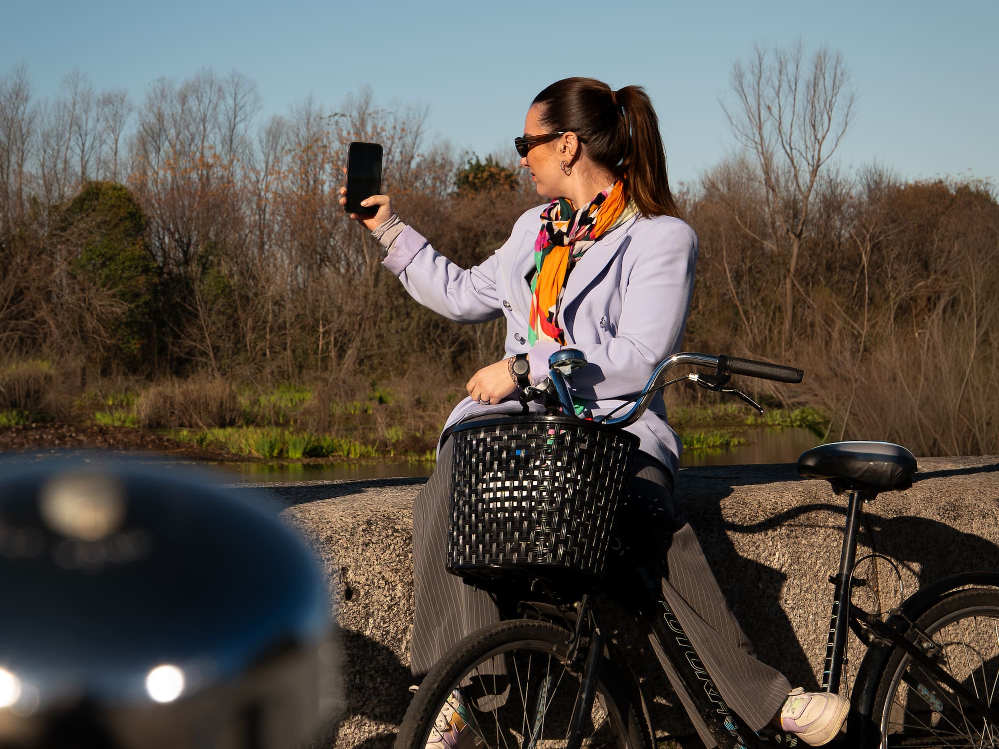 a woman on a bicycle taking a selfie