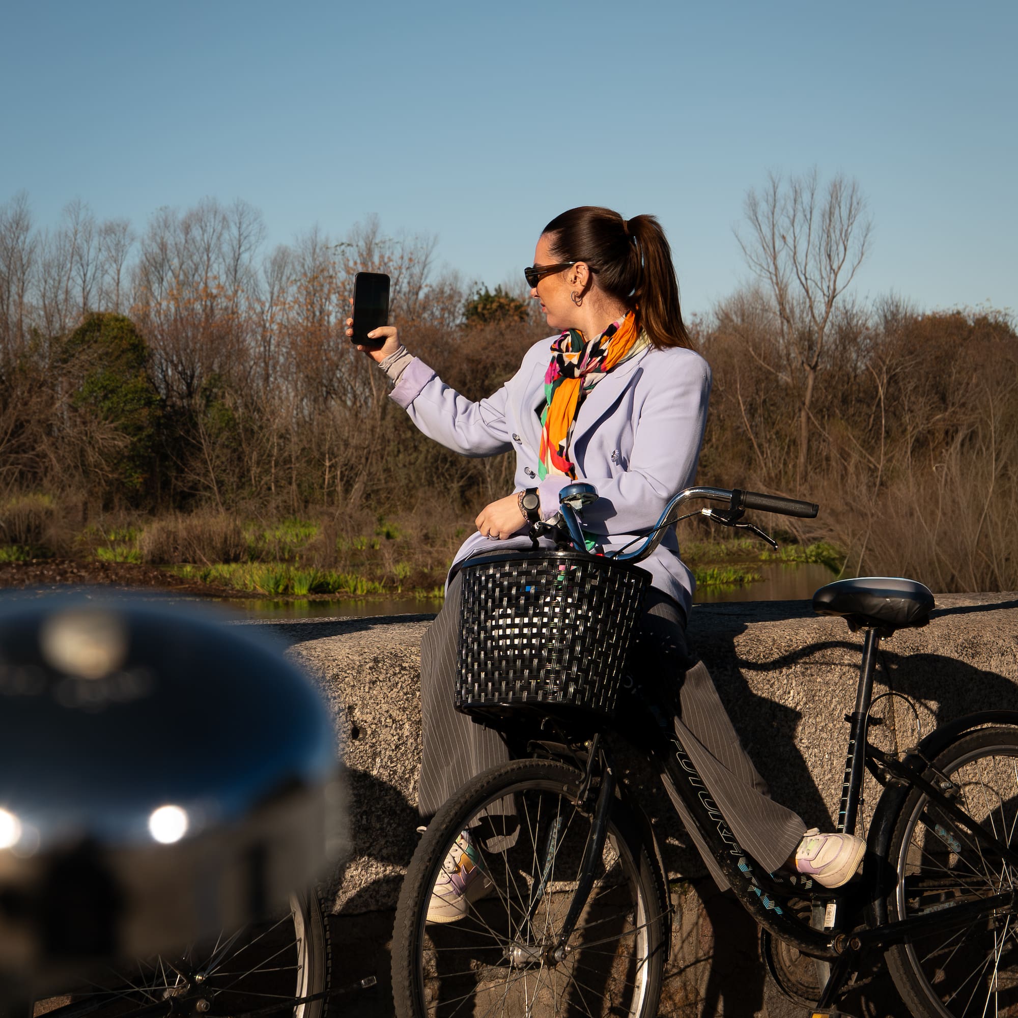 a woman on a bicycle taking a selfie