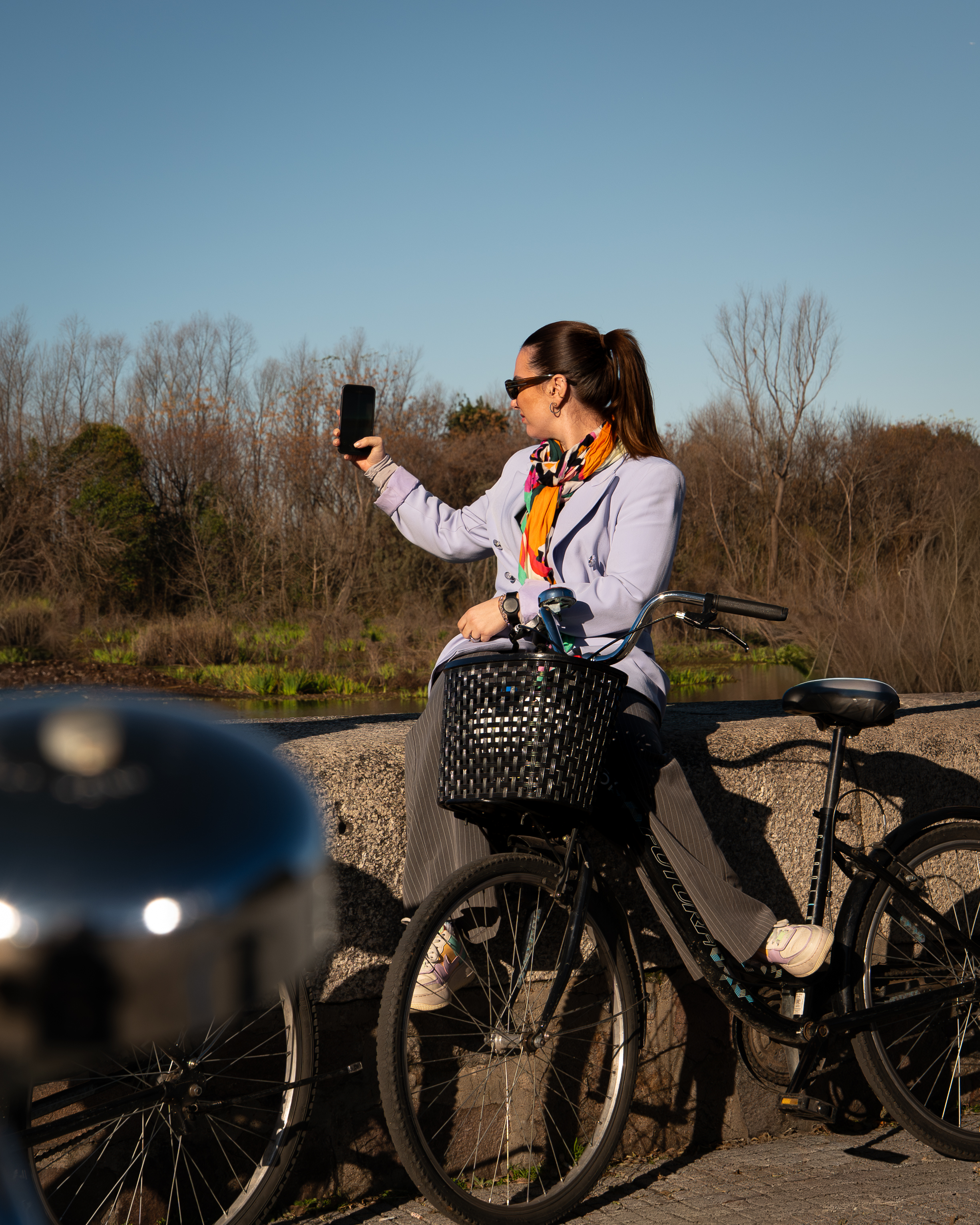 a woman on a bicycle taking a selfie
