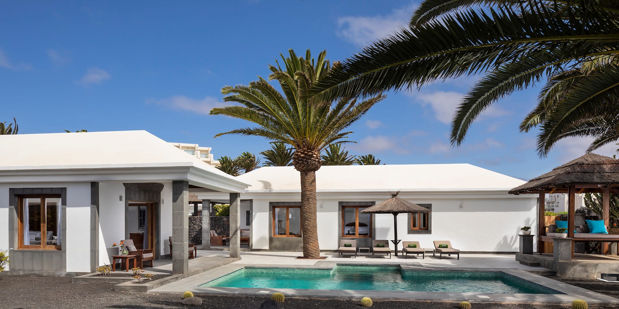 a swimming pool in a white house