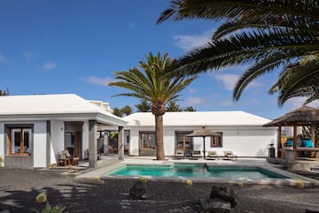 a swimming pool in a white house