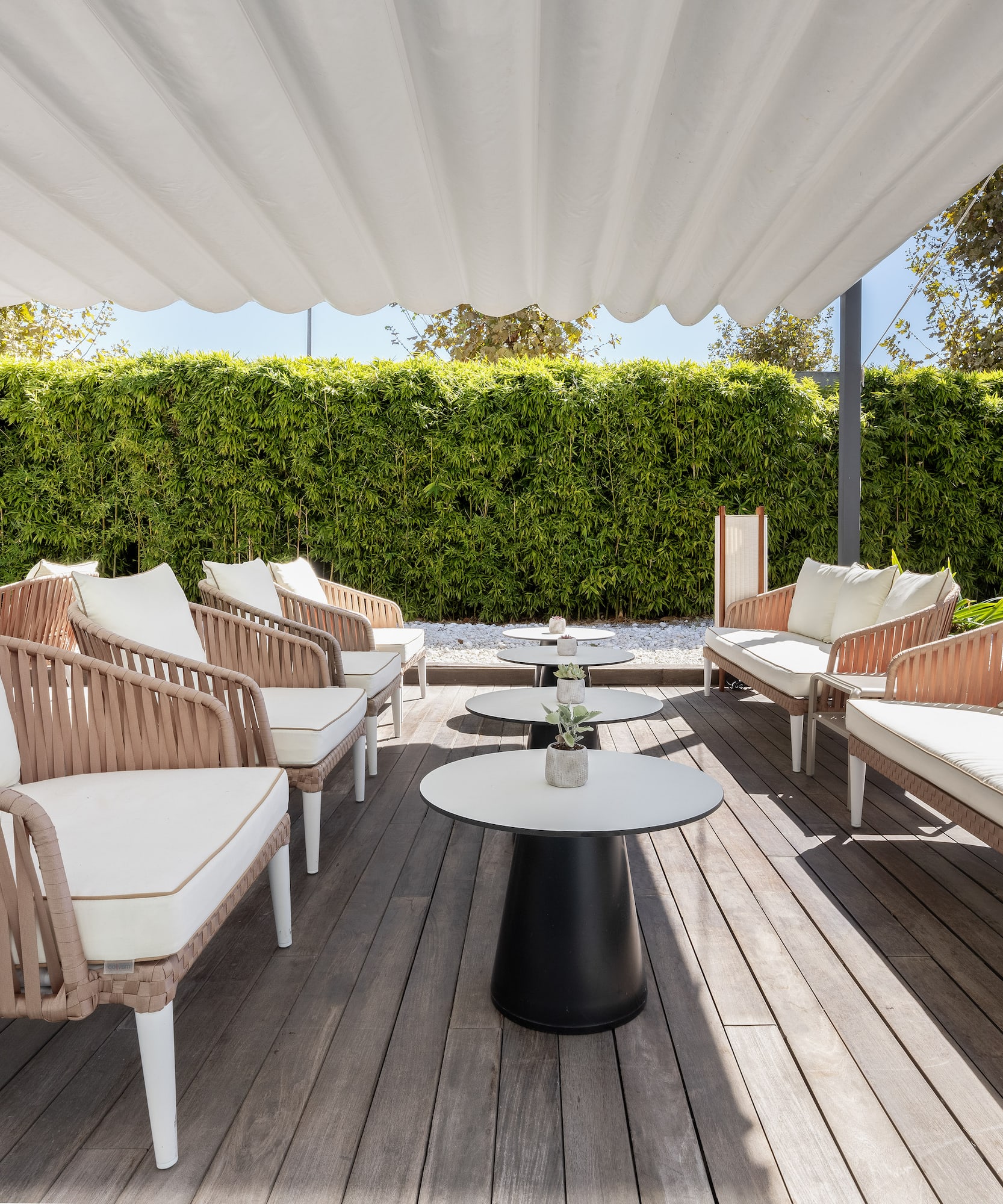 a patio with chairs and tables