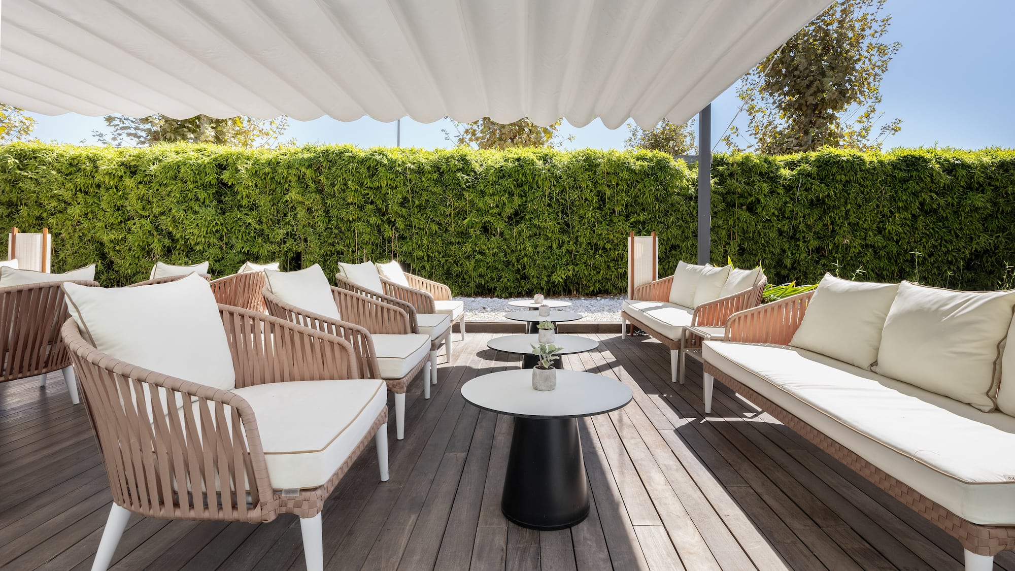 a patio with chairs and tables