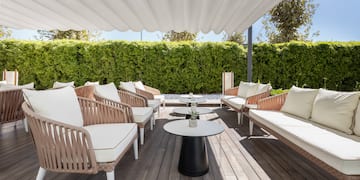 a patio with chairs and tables