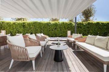 a patio with chairs and tables