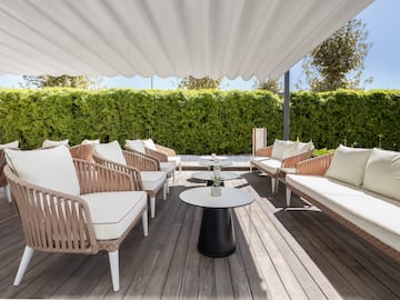 a patio with chairs and tables