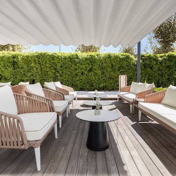 a patio with chairs and tables