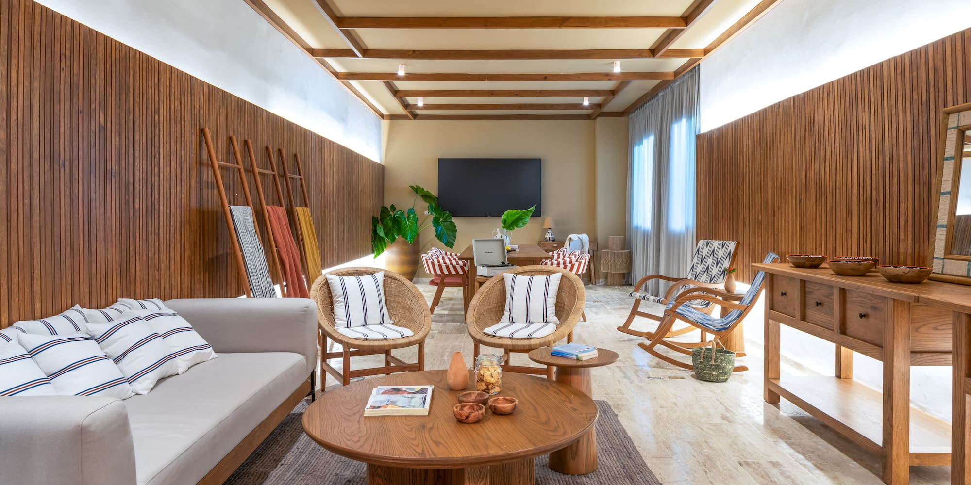 a room with a couch and chairs