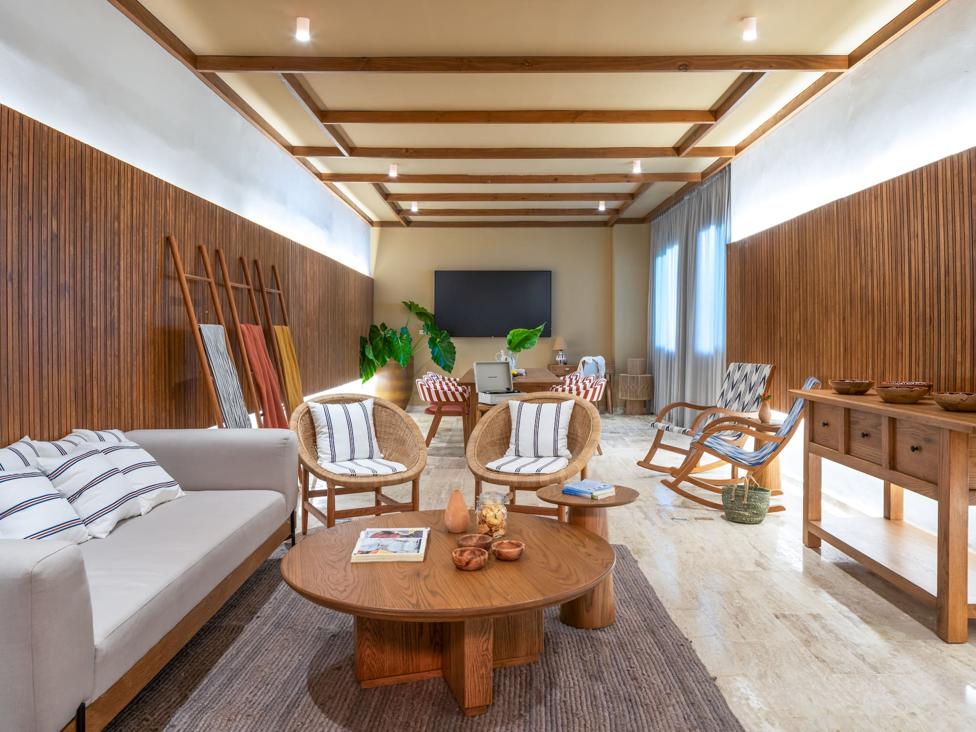 a room with a couch and chairs