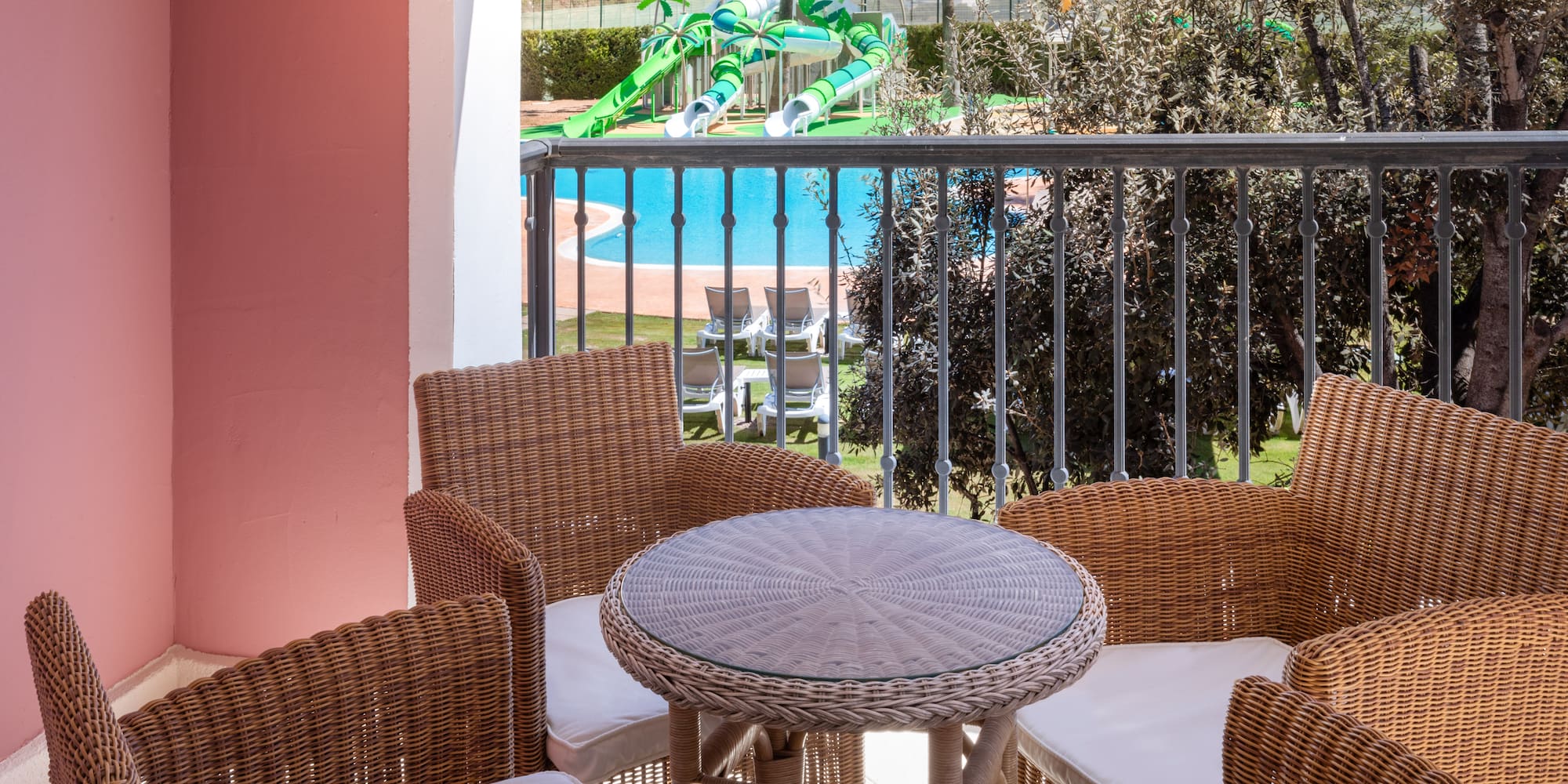 a table and chairs on a balcony