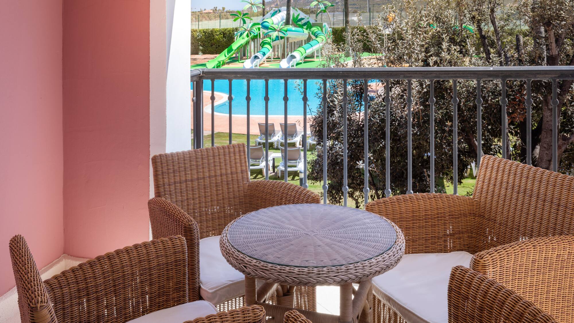 a table and chairs on a balcony