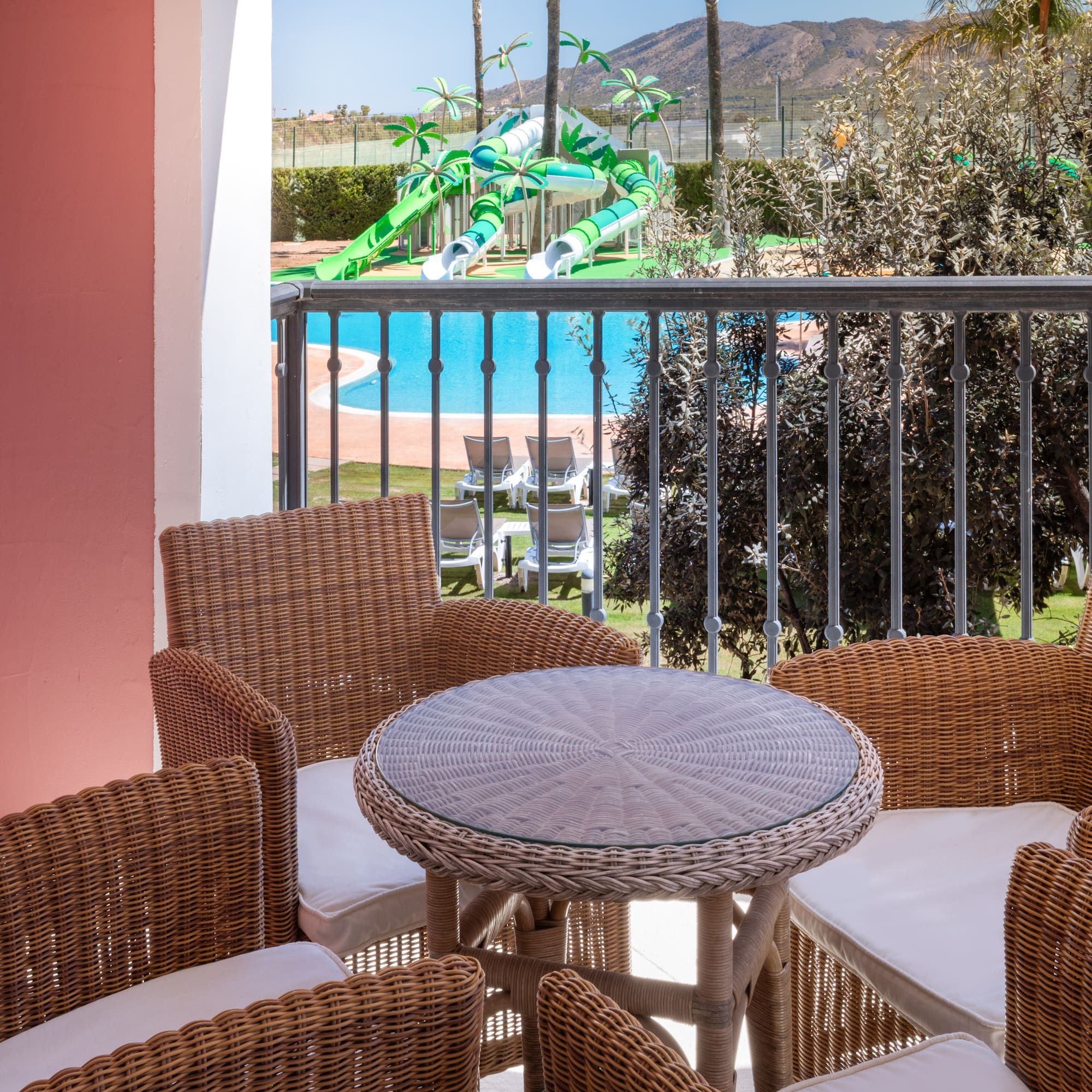 a table and chairs on a balcony