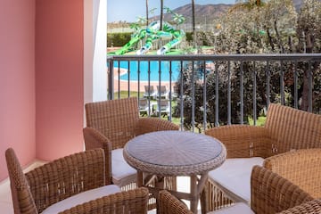 a table and chairs on a balcony