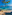 a beach with boats in the water