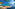 a beach with boats in the water