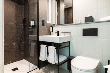 a bathroom with a shower and sink