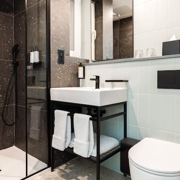 a bathroom with a shower and sink