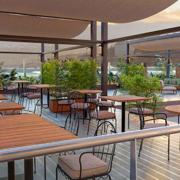 a patio with tables and chairs