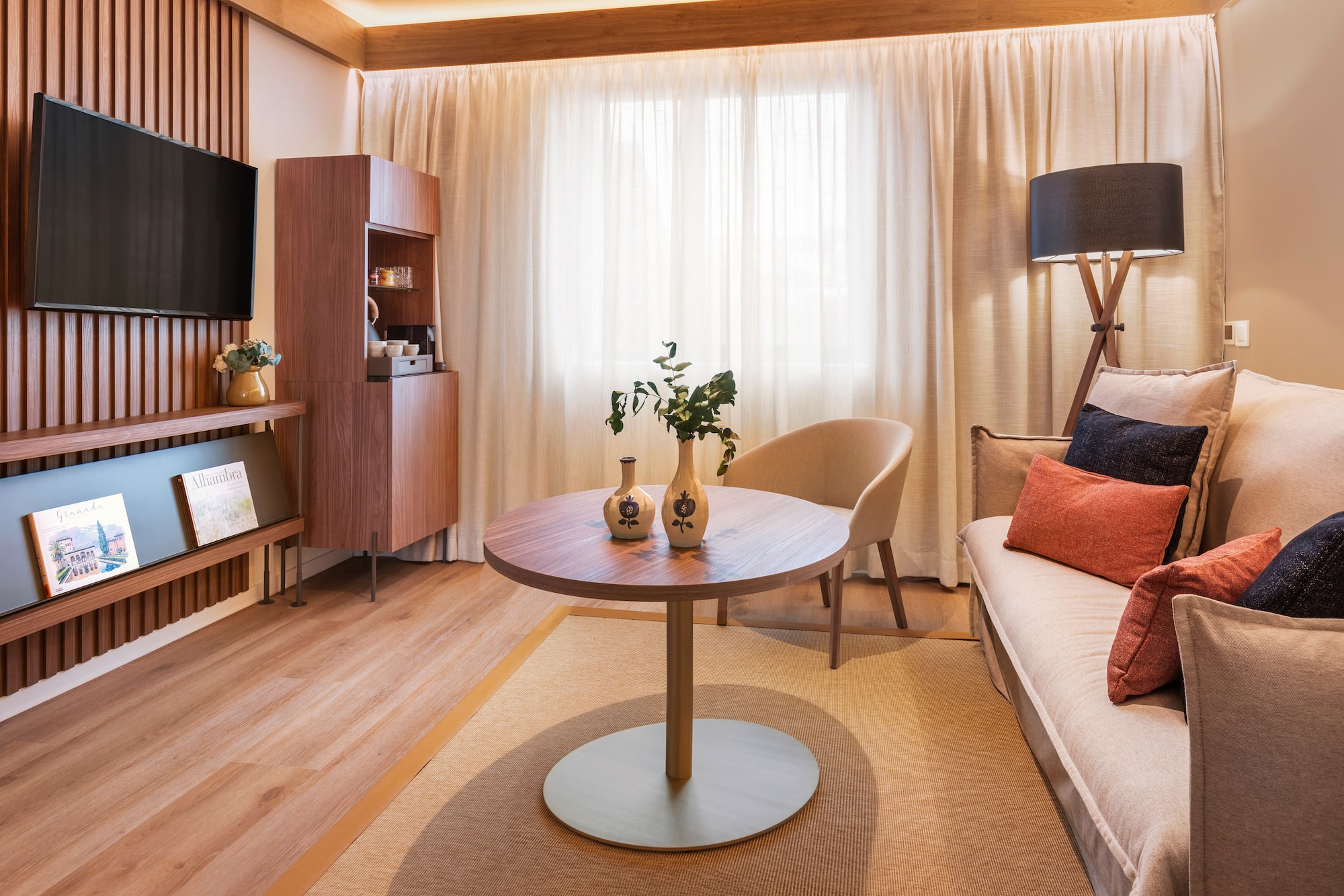 a living room with a table and a tv