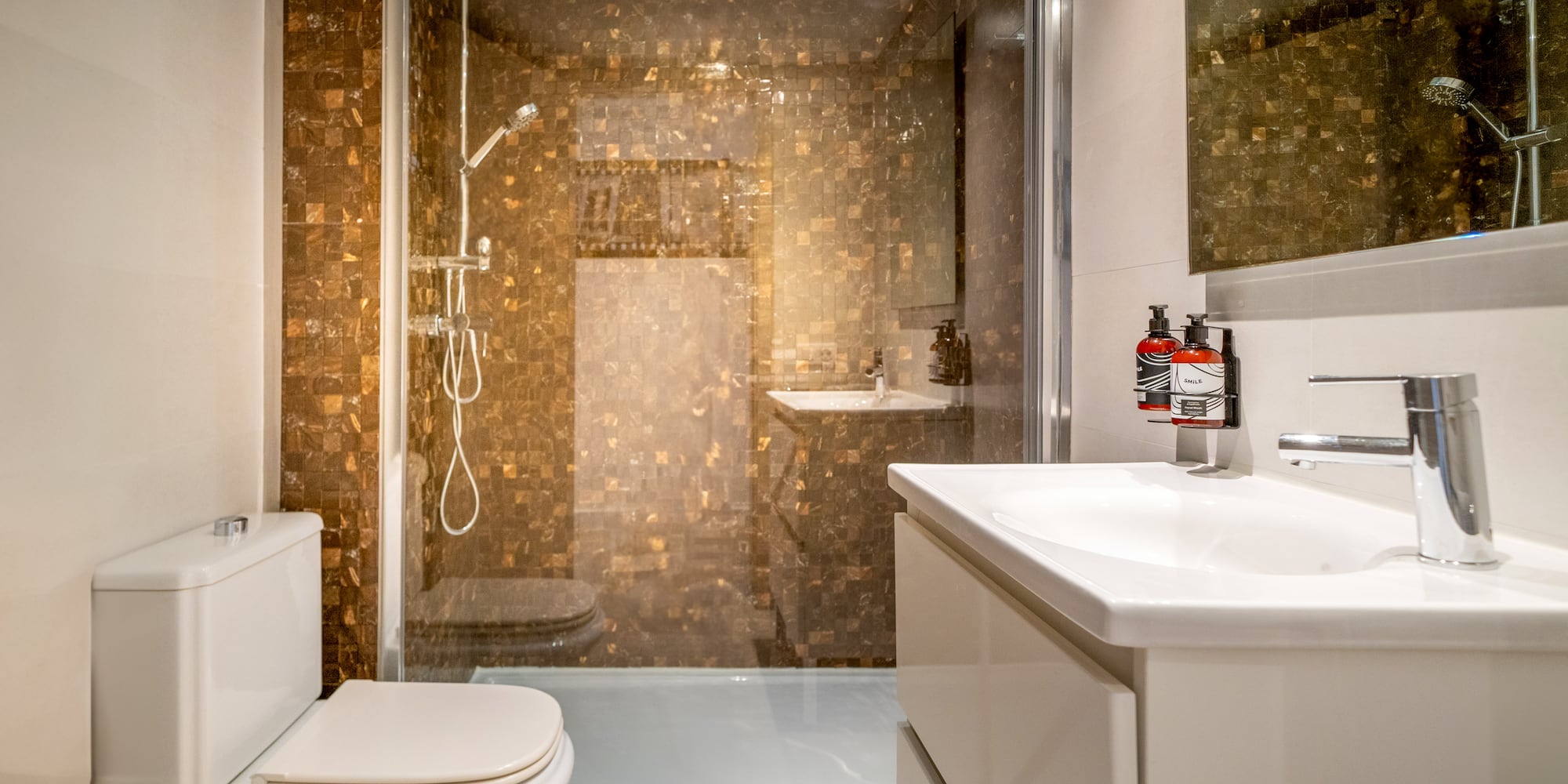 a bathroom with a shower and sink