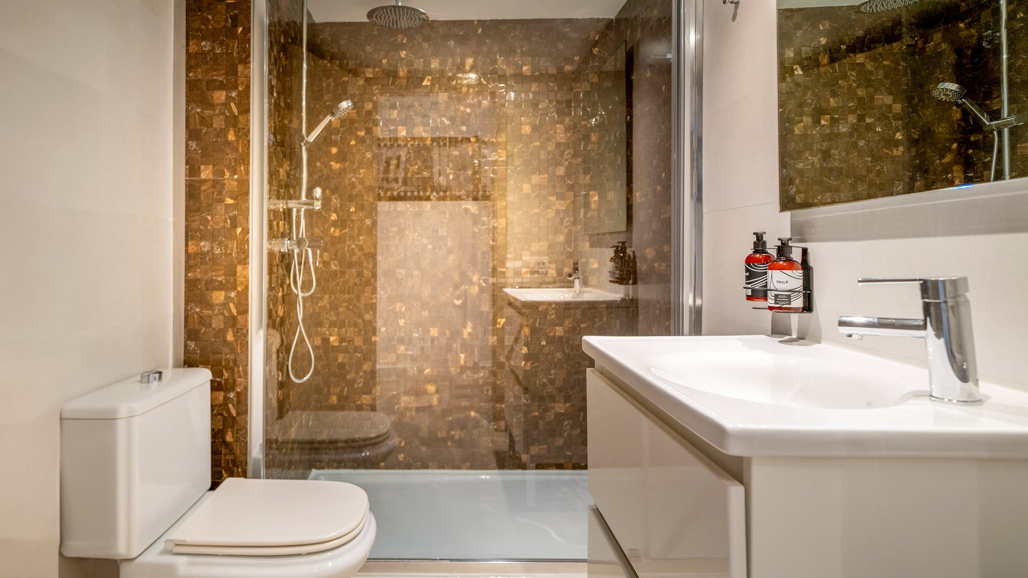 a bathroom with a shower and sink