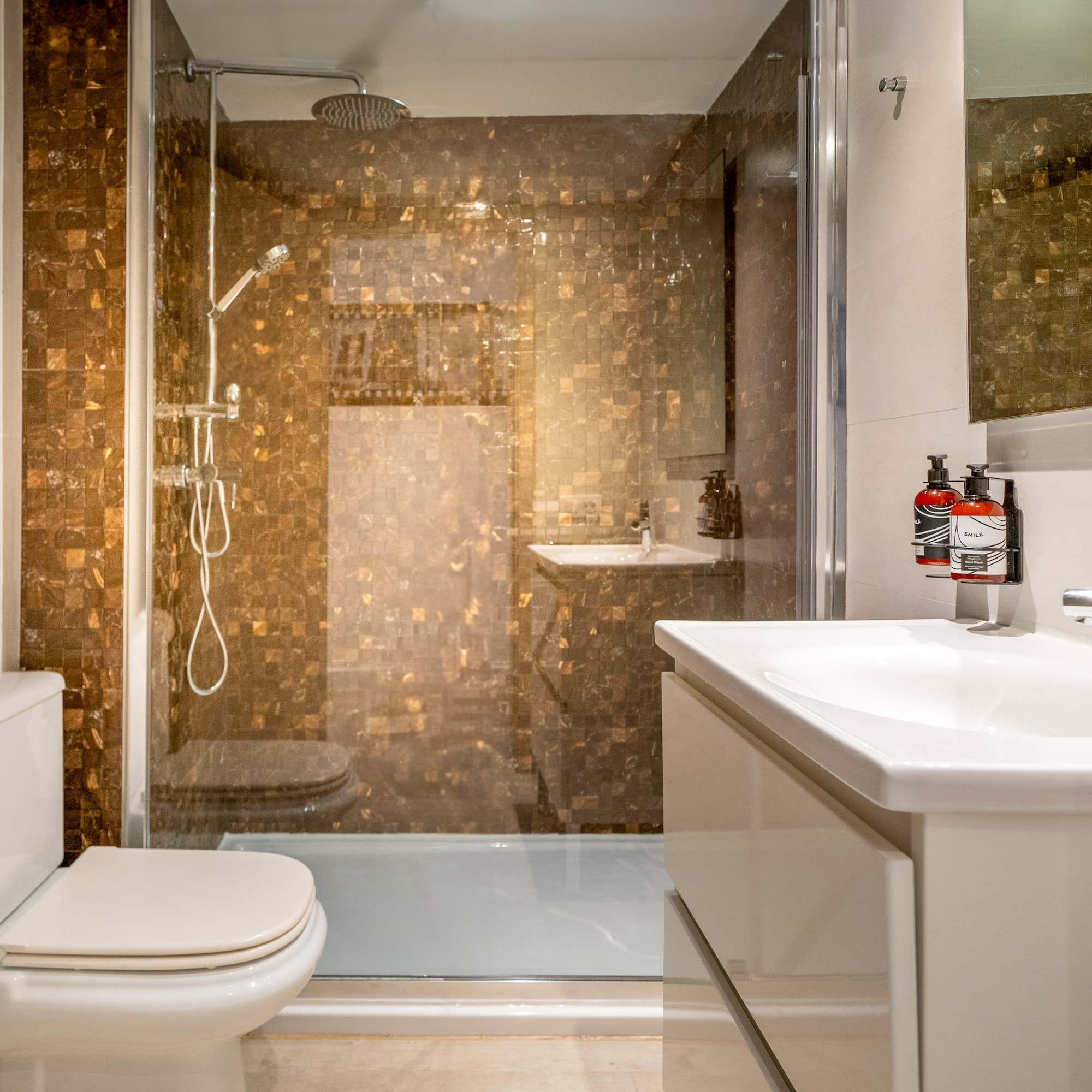 a bathroom with a shower and sink