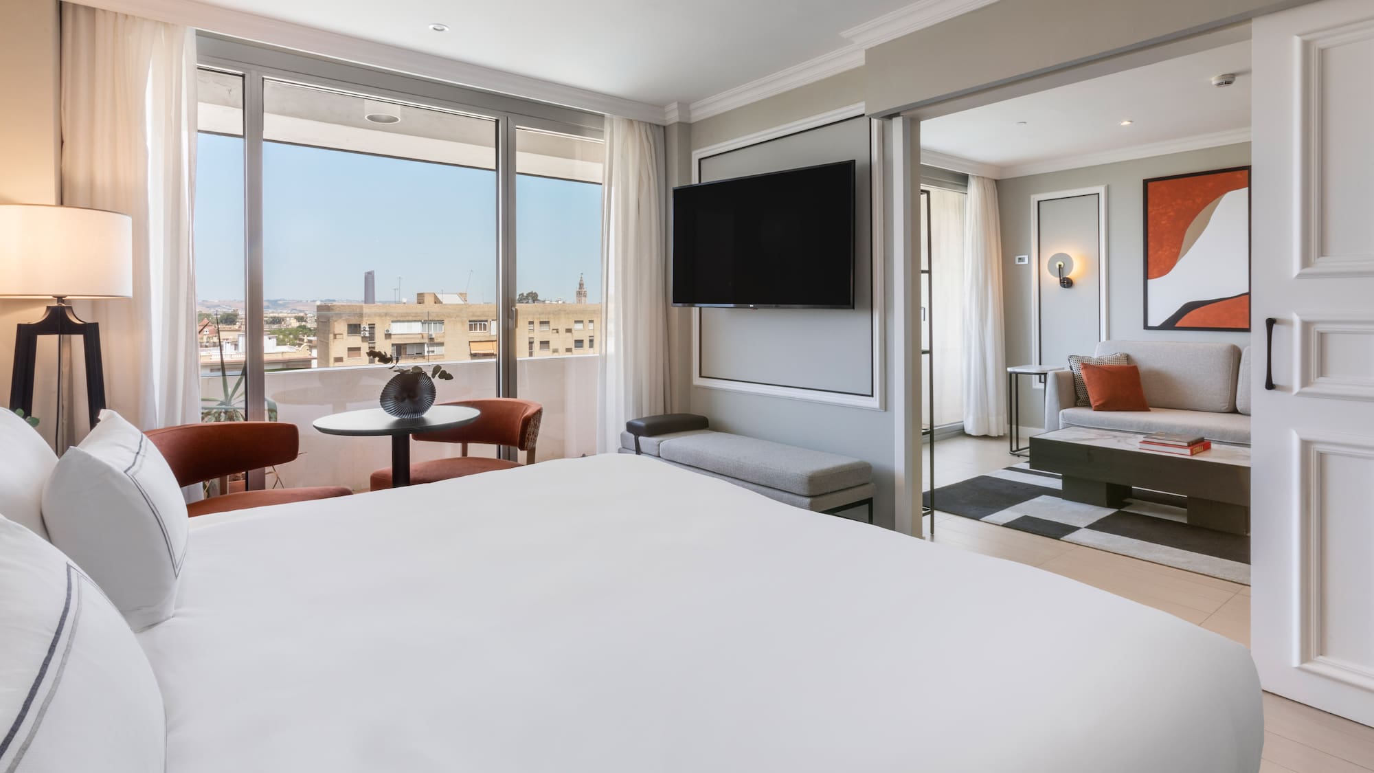 a bedroom with a television and a bed