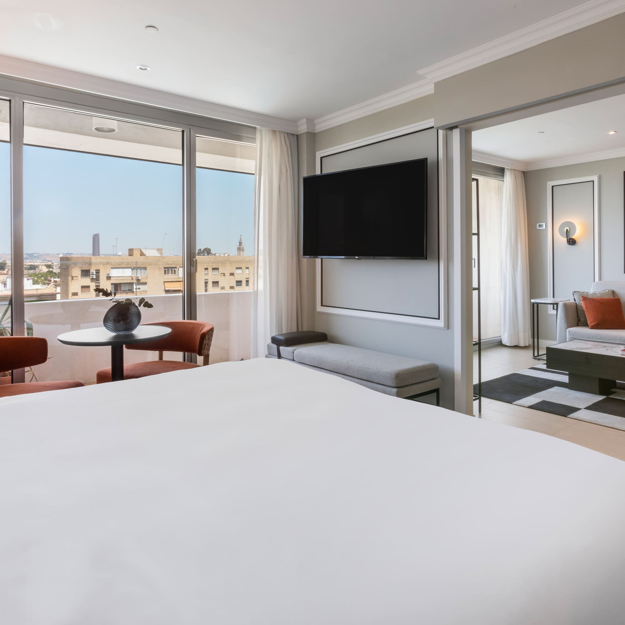 a bedroom with a television and a bed