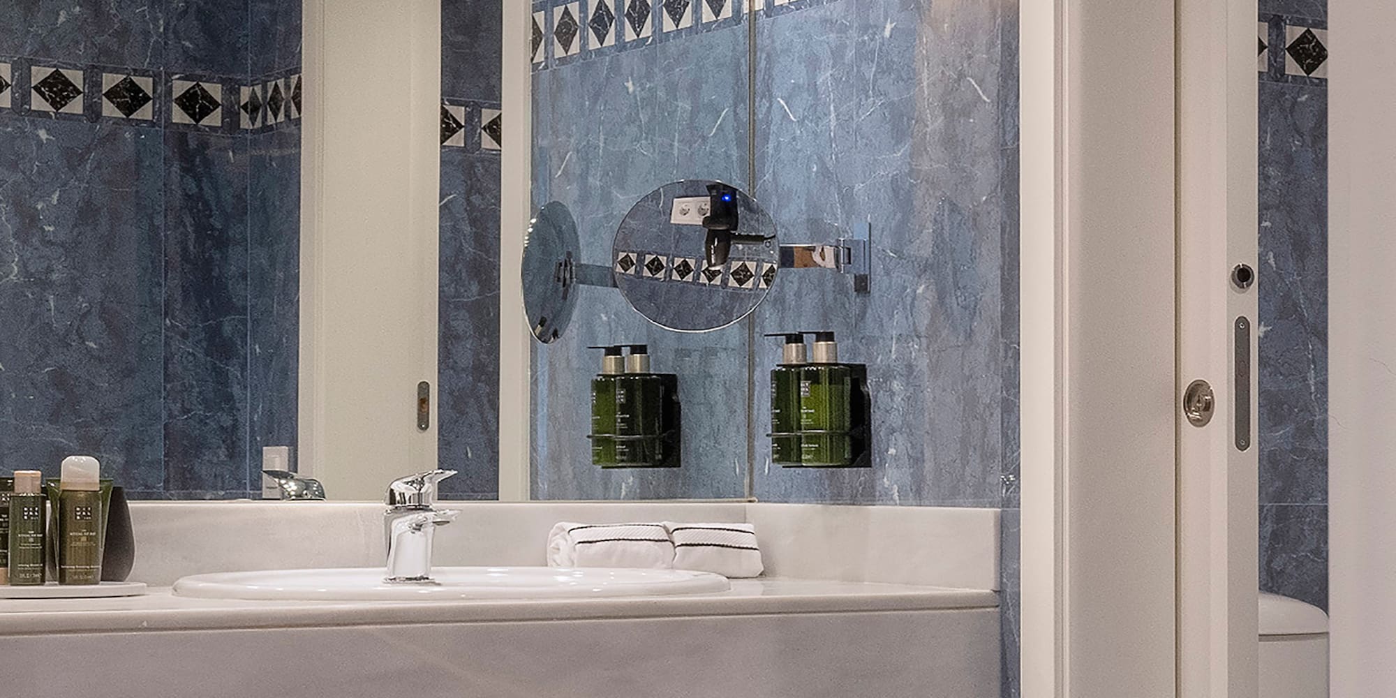 a bathroom with a mirror and sink